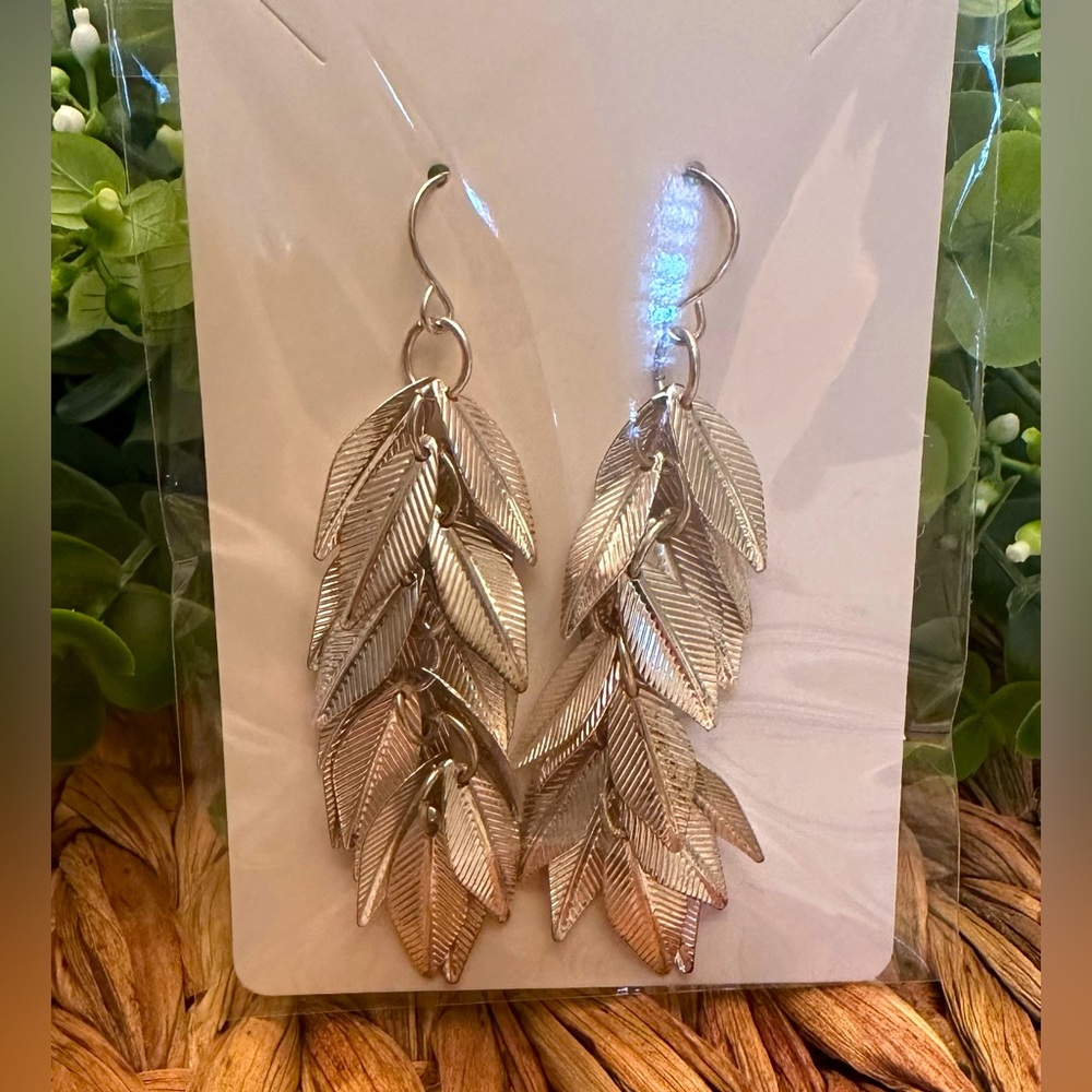 Feather dangling earrings - silver tone - never worn